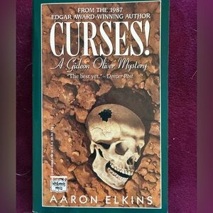 Paperback Book: Curses! by Aaron Elkins